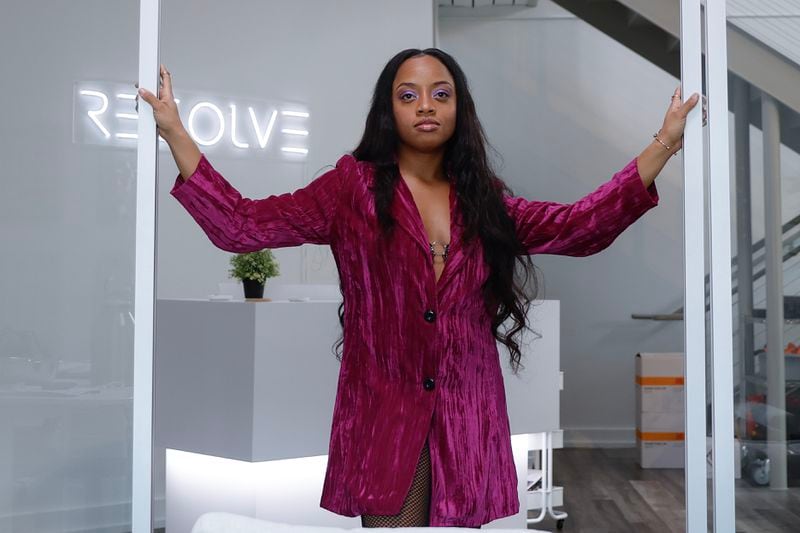 Malia Dishon is pictured at Resolve Media Group, an Atlanta company that helps produce the videos she creates. After building a career of fostering the creative vision of the city's top artists, Dishon plans to introduce herself as a singer this year.(Natrice Miller/natrice.miller@ajc.com)  