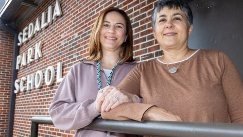 Cobb County Schools social worker Julie Lance (left) stands with Liz Platner, founder of the all-volunteer PORCH-Marietta. The organization helps with food and snacks for kids, at Sedalia Park Elementary School in Marietta. PHIL SKINNER FOR THE ATLANTA JOURNAL-CONSTITUTION