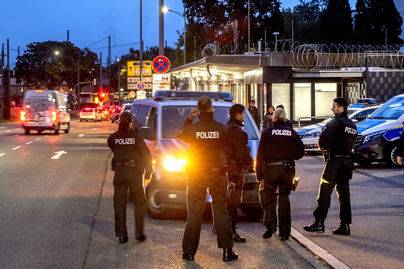 German police officers stand at the border between Germany and France in Kohl, Germany, Monday, Sept. 16, 2024 as Germany controls all his borders from Monday on. (AP Photo/Michael Probst)