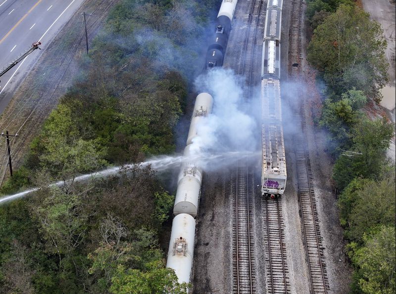 Firefighters work on the scene of a chemical leak in railcars near Cleves, Ohio, Tuesday, Sept. 24, 2024. (Local 12/WKRC via AP)