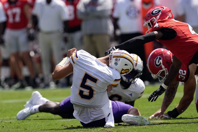 Tennessee Tech quarterback Jordyn Potts (5) is sacked by Georgia defensive back KJ Bolden (4) during the first half of an NCAA college football game Saturday, Sept. 7, 2024, in Athens, Ga. (AP Photo/John Bazemore)