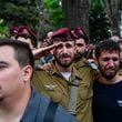 Mourners attend the funeral of Sgt. First Class Nazar Itkin who was killed during Israel's ground operation against Hezbollah militants in Lebanon, in Kiryat Ata, Israel, Sunday, Oct. 6, 2024. (AP Photo/Baz Ratner)