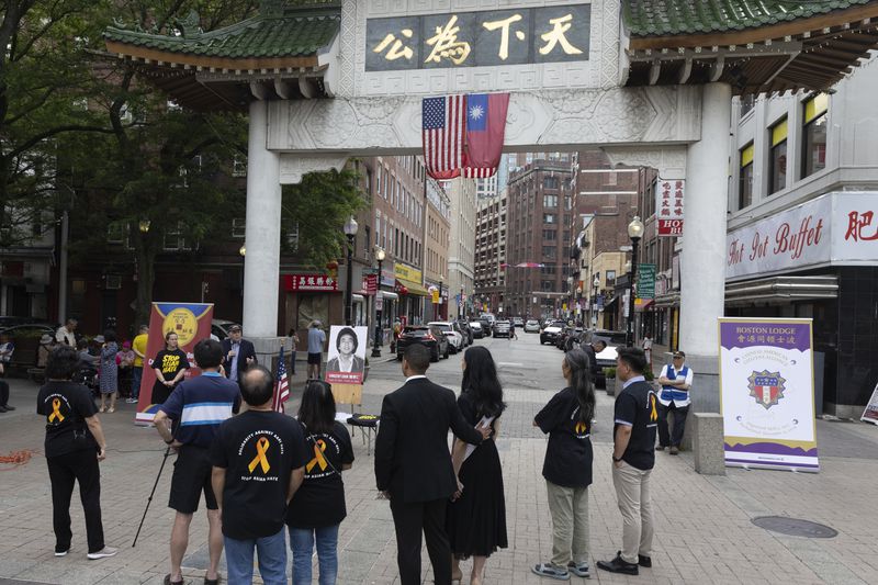 People gather for a remembrance ceremony for Vincent Chin in Chinatown, Sunday, June 23, 2024, in Boston. Over the weekend, vigils were held across the country to honor the memory of Chin, who was killed by two white men in 1982 in Detroit. (AP Photo/Michael Dwyer)