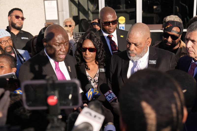 Attorney Ben Crump, left, speaks during a news conference with RowVaughn Wells, center, and Rodney Wells, right, parents of Tyre Nichols, outside the federal courthouse after three former Memphis police officers were convicted of witness tampering charges in the 2023 fatal beating of their son Nichols, Thursday, Oct. 3, 2024, in Memphis, Tenn. (AP Photo/George Walker IV)