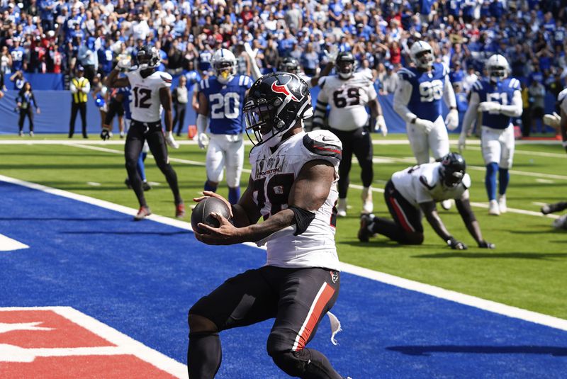 Houston Texans running back Joe Mixon (28) runs to the end zone for a touchdown during the second half of an NFL football game against the Indianapolis Colts, Sunday, Sept. 8, 2024, in Indianapolis. (AP Photo/Darron Cummings)