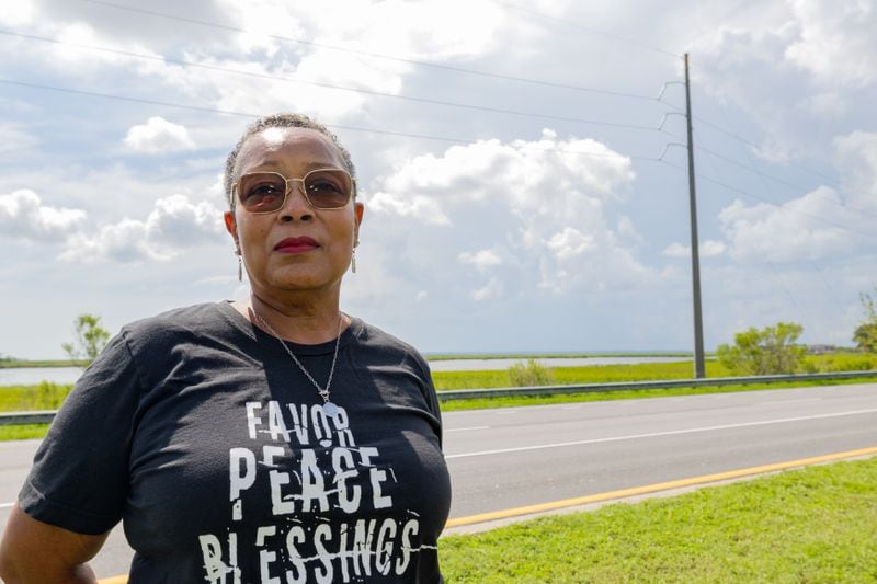 Semona Holmes poses for a photo in front of the marsh near her Brunswick home.