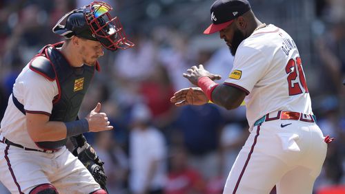 Atlanta Braves' Sean Murphy, left, and designated hitter Marcell Ozuna (20) celebrate after defeating the Oakland Athletics in a baseball game Sunday, June 2, 2024, in Atlanta. (AP Photo/John Bazemore)