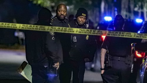 Atlanta homicide investigators work at the scene of an October shooting on Highview Road in the Beecher Hills neighborhood and found a 57-year-old woman with a gunshot wound to her body. She was transported to Grady Memorial Hospital, where she died. (John Spink / John.Spink@ajc.com)