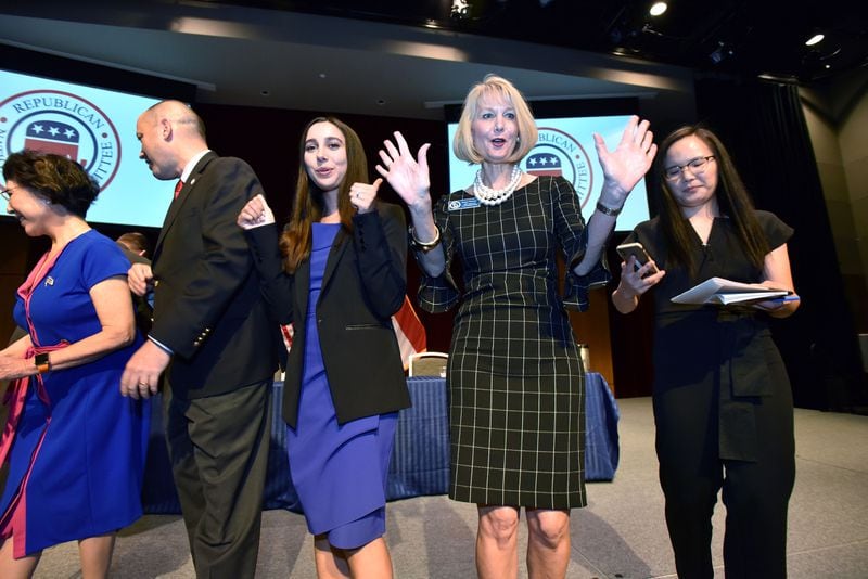 Ginger Howard (second from right) and other VIP guests pose for a group photograph on stage during Trump Victory Asian Pacific American Community Outreach & TVLI training event at City Springs on Saturday, September 28, 2019. (Hyosub Shin / Hyosub.Shin@ajc.com)