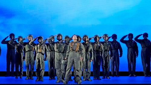 This image released by the Metropolitan Opera shows Emily D'Angelo as Jess, center, during a performance of Jeanine Tesori's "Grounded" in New York on Sept. 16, 2024. (Ken Howard/Met Opera via AP)