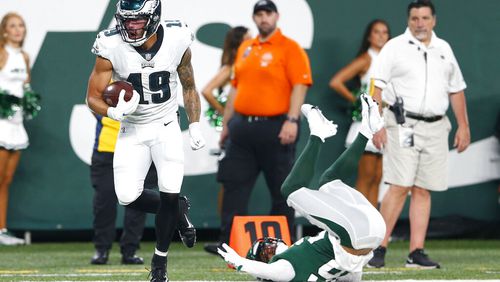 Philadelphia Eagles' J.J. Arcega-Whiteside (19) breaks a tackle by New York Jets' Elijah Campbell (26) to score a touchdown during the first half of an NFL preseason football game Friday, Aug. 27, 2021, in East Rutherford, N.J. (AP Photo/Noah K. Murray)