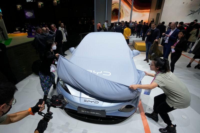 FILE - Chinese EV manufacturer BYD unveils its electric car Seal at the Paris Car Show on Oct. 17, 2022, in Paris. (AP Photo/Michel Euler, File)