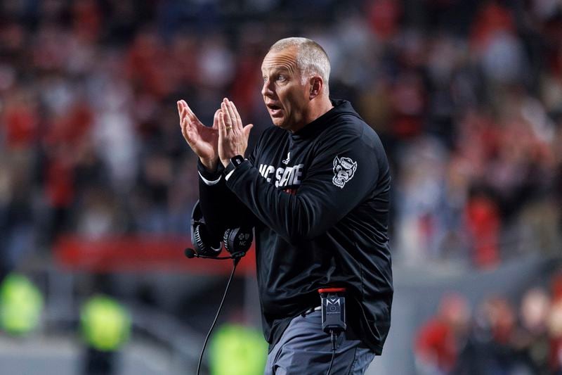 FILE - North Carolina State head coach Dave Doeren claps for his team during an NCAA college football game against Miami in Raleigh, N.C., Nov. 4, 2023. (AP Photo/Ben McKeown, File)