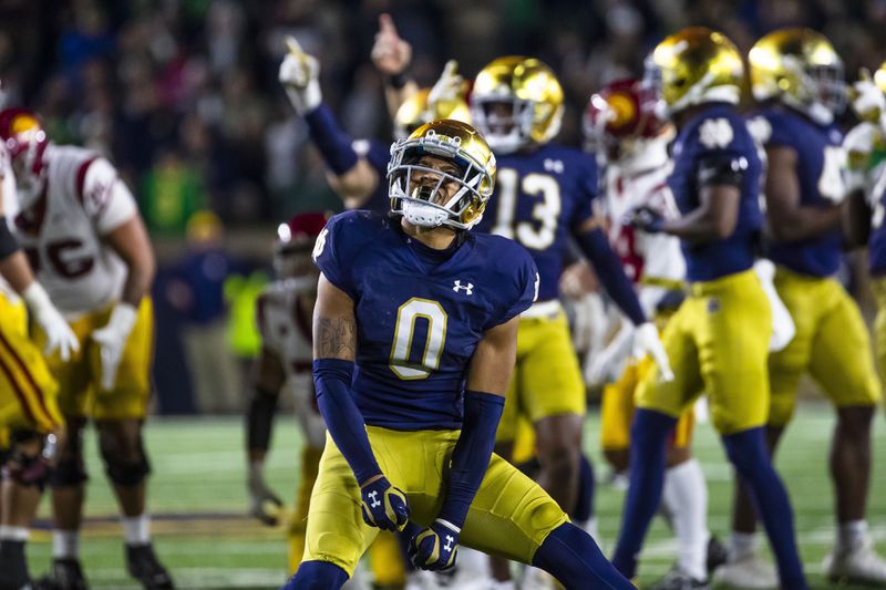 FILE - Notre Dame safety Xavier Watts (0) celebrates during the second half of an NCAA college football game against Southern California Saturday, Oct. 14, 2023, in South Bend, Ind. (AP Photo/Michael Caterina, File)