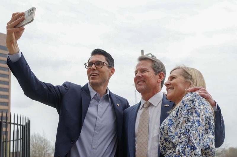 (Left to right) Rivian CEO RJ Scaringe, Gov. Brian Kemp and Marty Kemp posed for a selfie on Rivian Day at the Georgia State Capitol last year.