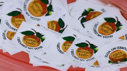 Georgia voter stickers are shown at the Roswell Library on Friday, May 20, 2022. (Natrice Miller/AJC)