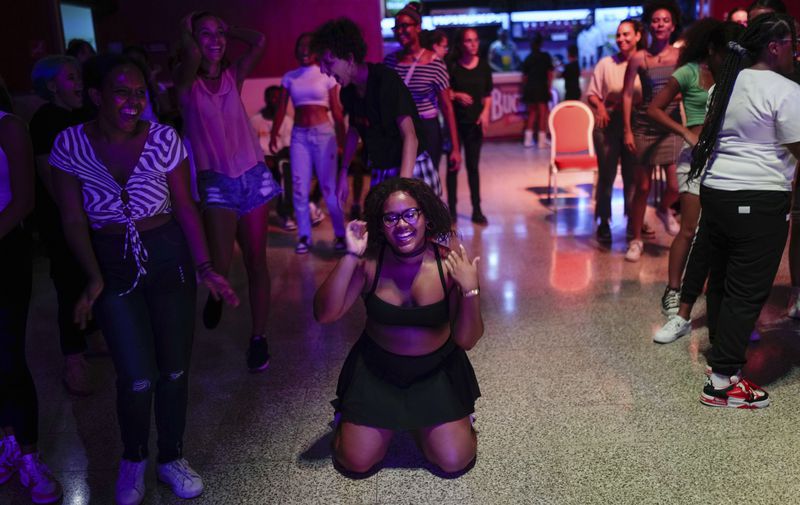 Teenagers dance to K-pop, popular Korean music, at a cultural house in Havana, Cuba, Saturday, Sept. 7, 2024. (AP Photo/Ramon Espinosa)