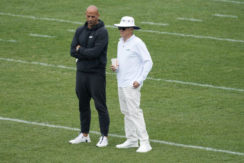 New York Jets head coach Robert Saleh, left, talks to team owner Woody Johnson during practice at the NFL football team's training facility in Florham Park, N.J., Tuesday, June 11, 2024. (AP Photo/Pamela Smith)