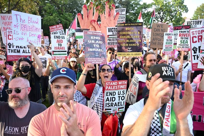 Protesters watch during a demonstration near the Democratic National Convention Thursday, Aug. 22, 2024, in Chicago. (AP Photo/Noah Berger)