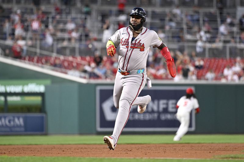 Atlanta Braves' Marcell Ozuna advances to third base on a Braves' Matt Olson RBI double during the third inning of a baseball game against the Washington Nationals, Tuesday, Sept. 10, 2024, in Washington. (AP Photo/John McDonnell)