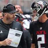 Falcons head coach Arthur Smith and quarterback Matt Ryan confer in the final minutes against the Washington Football Team Sunday, Oct. 3, 2021, at Mercedes-Benz Stadium in Atlanta. (Curtis Compton / Curtis.Compton@ajc.com)