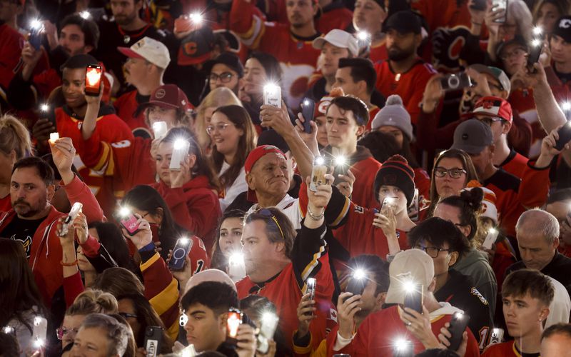 Fans attend a vigil for former Calgary Flames player Johnny Gaudreau and his brother Matthew in Calgary, Alberta., Wednesday, Sept. 4, 2024. (Jeff McIntosh/The Canadian Press via AP)