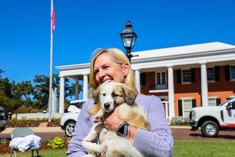 Georgia first lady Marty Kemp holds a dog during the Pet Adoption Day event at the Governor's Mansion last year.