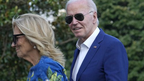 President Joe Biden smiles as he is asked questions by members of the media as he and first lady Jill Biden return to the White House on Sunday after attending campaign events in Pennsylvania. (AP Photo/Susan Walsh)