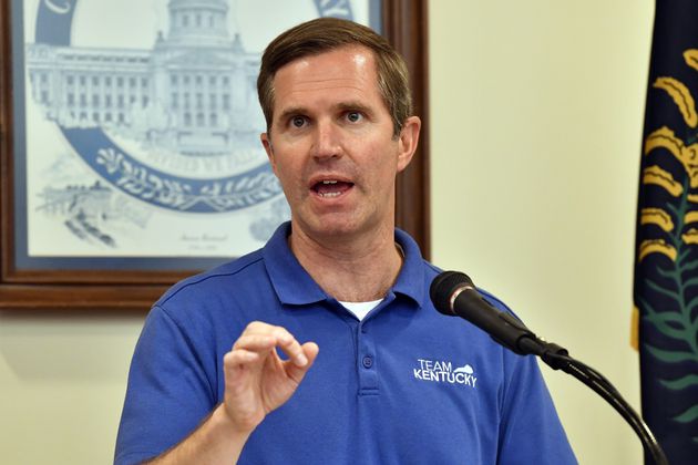 Kentucky Gov. Andy Beshear addresses a crowd gathered at the Breathitt Co. Courthouse to discuss progress in flood recovery efforts in Jackson, Ky., Friday, July 26, 2024. (AP Photo/Timothy D. Easley)