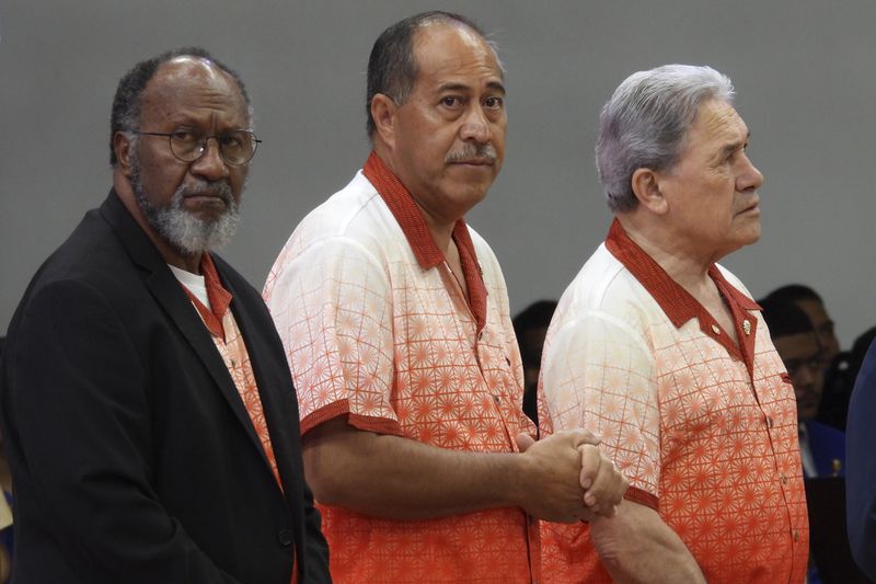 Vanuatu Prime Minister Charlot Salwai, from left, Niue Prime Minister Dalton Tagelagi and New Zealand Foreign Minister Winston Peters attend the opening of the annual Pacific Islands Forum leaders meeting in Nuku'alofa, Tonga, Monday, Aug. 26, 2024. (AP Photo/Charlotte Graham-McLay)