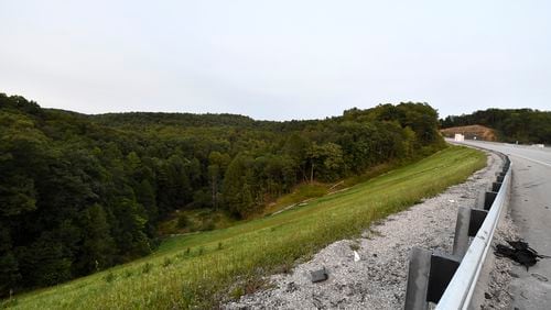 FILE - Trees stand in wooded areas alongside Interstate 75 near Livingston, Ky., Sunday, Sept. 8, 2024, as police search for a suspect in a shooting Saturday along the Interstate. (AP Photo/Timothy D. Easley, File)