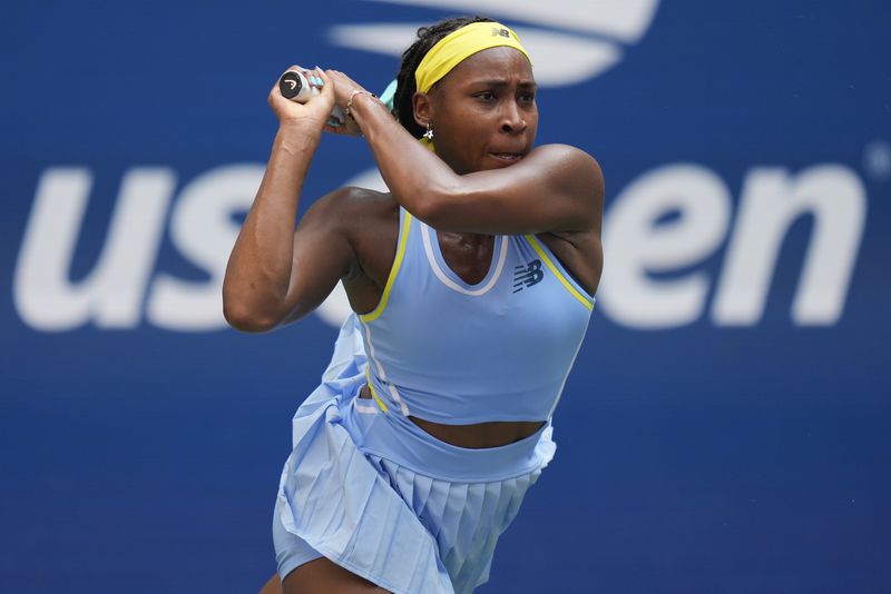 Coco Gauff, of the United States, returns a shot to Varvara Gracheva, of France, during the first round of the U.S. Open tennis championships, Monday, Aug. 26, 2024, in New York. (AP Photo/Seth Wenig)