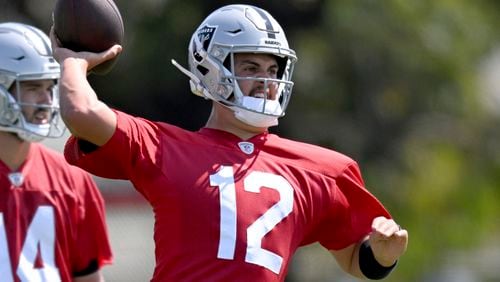 Las Vegas Raiders quarterback Aidan O'Connell works out during NFL football training camp, Thursday, July 25, 2024, in Costa Mesa, Calif. (AP Photo/John McCoy)