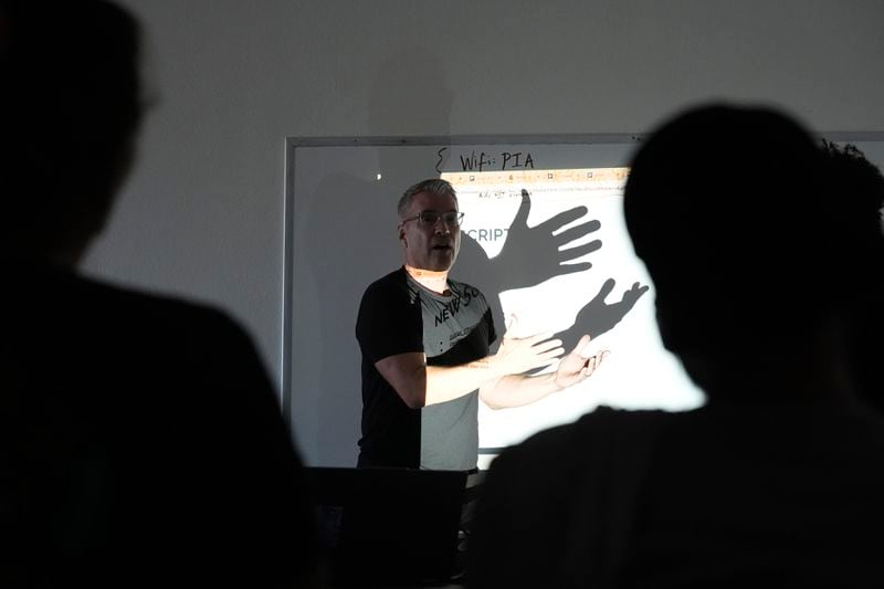 Randy Parraz, co-founder and president of the Organizing Institute for Democracy, speaks at a Poder In Action voter canvassing event Tuesday, Sept. 3, 2024, in Phoenix. (AP Photo/Ross D. Franklin)