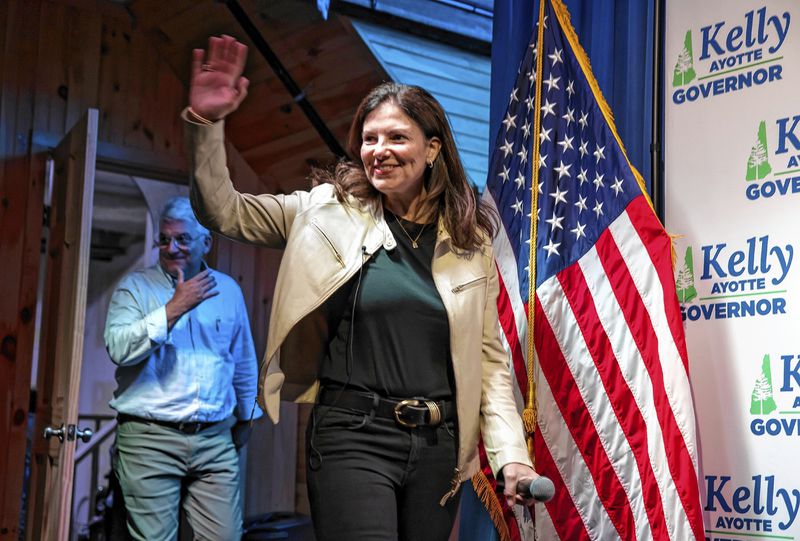 Republican gubernatorial candidate Kelly Ayotte waves to the crowd at Bonfire Country Bar in Manchester, N.H., after winning the Republican primary against former state Senate President Chuck Morse on Tuesday, Sept. 10, 2024. (Geoff Forester/The Concord Monitor via AP)