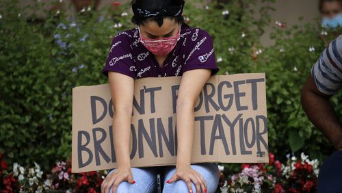 A protester remembering Breonna Taylor listens to a Black Lives Matters rally at City Hall in Dallas on Wednesday, June 3, 2020. Taylor was fatally shot by police officers in Louisville, Ky.