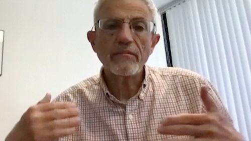 In this image from video, Dr. Eliezer Masliah, of the National Institute on Aging speaks during an interview in Bethesda, Md., May 2, 2024. (AP Photo)