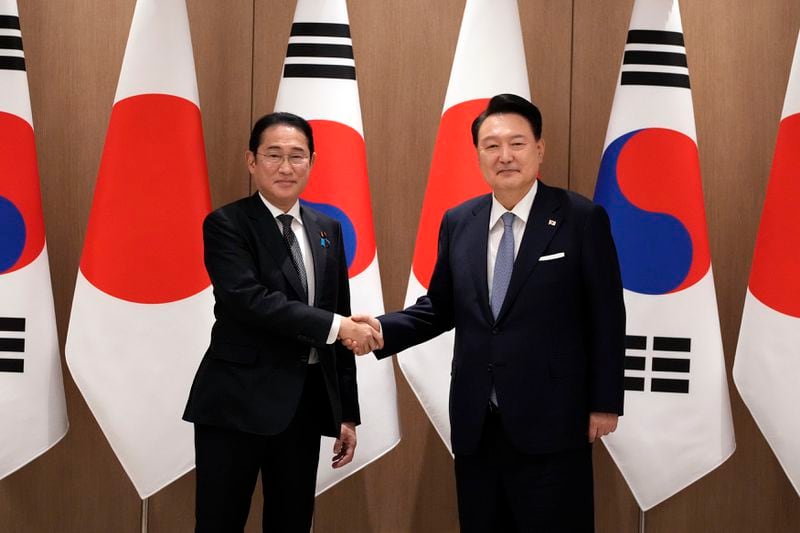 South Korean President Yoon Suk Yeol, right, and Japanese Prime Minister Fumio Kishida, left, shake hands during a meeting at the Presidential Office in Seoul, South Korea, Friday, Sept. 6, 2024. (AP Photo/Lee Jin-man, Pool)