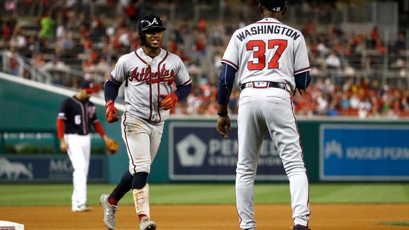 Ron Washington runs Braves rookie Ozzie Albies through fielding drills 