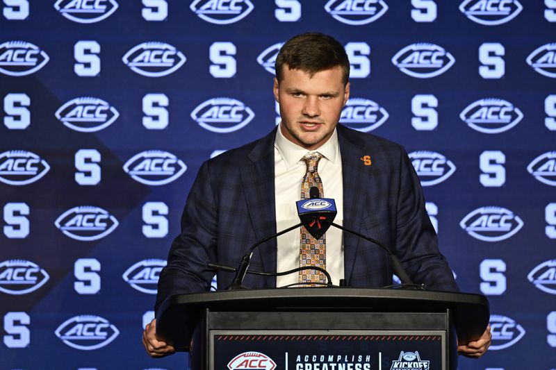 FILE - Syracuse quarterback Kyle McCord speaks during the Atlantic Coast Conference NCAA college football media days, Thursday, July 25, 2024, in Charlotte, N.C. (AP Photo/Matt Kelley, File)