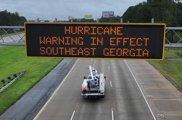 Hurricane warning sign is displayed on I-75 near Adel, Thursday, September 26, 2024. Hurricane Helene is set to make landfall as a major storm in Florida on Thursday evening, bringing rain and damaging wind to Georgia. Emergency officials are warning of fallen trees, downed power lines, shuttered roads and even the possibility of landslides as Helene makes its way through Georgia overnight. (Hyosub Shin / AJC)