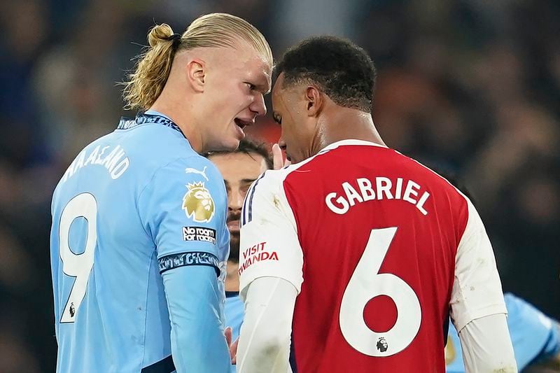 Manchester City's Erling Haaland has a disagreement with Arsenal's Gabriel during the English Premier League soccer match between Manchester City and Arsenal at the Etihad stadium in Manchester, England, Sunday, Sept. 22, 2024. (AP Photo/Dave Thompson)