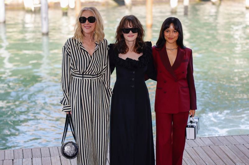 Catherine O'Hara, from left, Winona Ryder, and Jenna Ortega pose for photographers upon arrival for the press conference of the film 'Beetlejuice Beetlejuice' during the 81st edition of the Venice Film Festival in Venice, Italy, on Wednesday, Aug. 28, 2024. (Photo by Vianney Le Caer/Invision/AP)