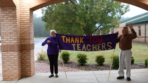 Carol and Barry Walton, grandparents of three students at Kedron Elementary in Peachtree City, created a banner that showed appreciation for the school's teachers.