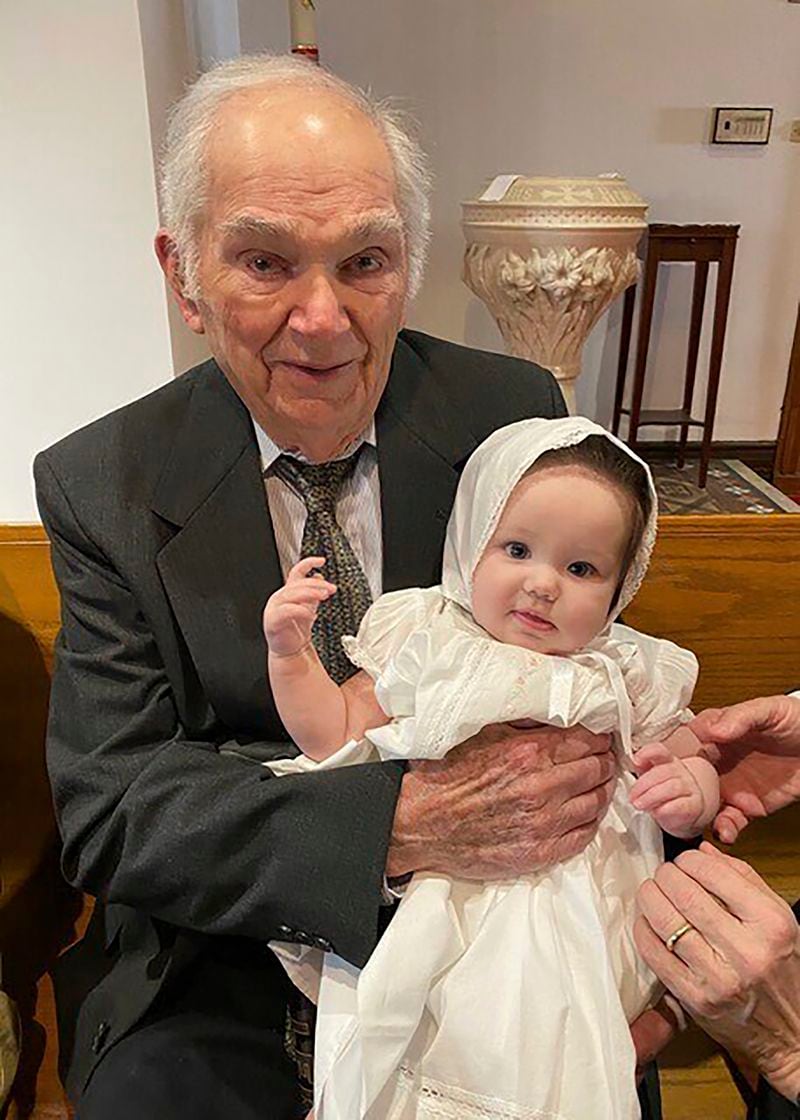 This undated photo provided by Linda Mitchelle shows Orville Allen of Poplar Bluff, Mo., holding his great-granddaughter at her baptism. Allen died Wednesday, May 29, 2024, and his liver was successfully donated and transplanted to a 72-year-old woman. Transplant organizations say Allen is the oldest American ever to donate an organ upon death. (Linda Mitchelle via AP)