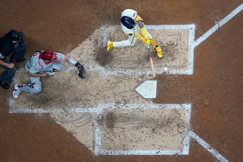 Milwaukee Brewers' Joey Ortiz hits an RBI triple during the sixth inning of a baseball game against the Philadelphia Phillies Monday, Sept. 16, 2024, in Milwaukee. (AP Photo/Morry Gash)