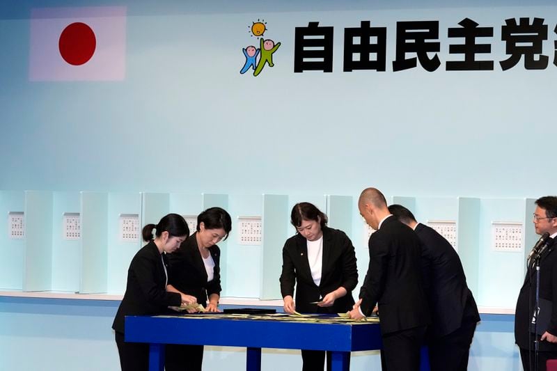 Officials count ballots during the Liberal Democratic Party's (LDP) leadership election at the LDP headquarters Friday, Sept. 27, 2024, in Tokyo. (AP Photo/Hiro Komae, Pool)