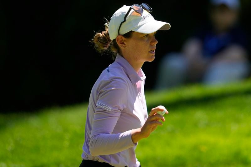 Sarah Schmelzel holds her ball after finishing the 16th hole during the second round of the Women's PGA Championship golf tournament at Sahalee Country Club, Friday, June 21, 2024, in Sammamish, Wash. (AP Photo/Lindsey Wasson)