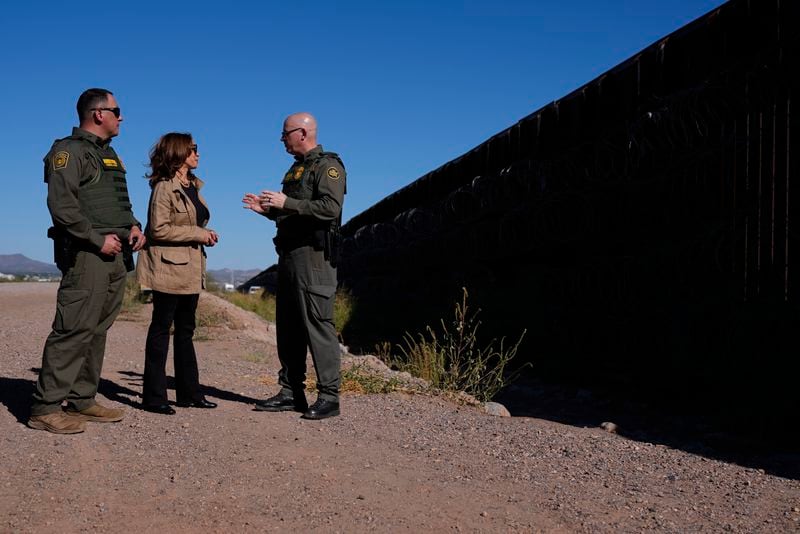 Democratic presidential nominee Vice President Kamala Harris talks with John Modlin, the chief patrol agent for the Tucson Sector of the U.S. Border Patrol, right, and Blaine Bennett, the U.S. Border Patrol Douglas Station border patrol agent in charge, as she visits the U.S. border with Mexico in Douglas, Ariz., Friday, Sept. 27, 2024. (AP Photo/Carolyn Kaster)