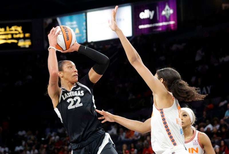 Las Vegas Aces center A'ja Wilson (22) shoots over Connecticut Sun forward Olivia Nelson-Ododa (10) during the first half of a WNBA basketball game Sunday, Sept. 15, 2024, in Las Vegas. (Steve Marcus/Las Vegas Sun via AP)